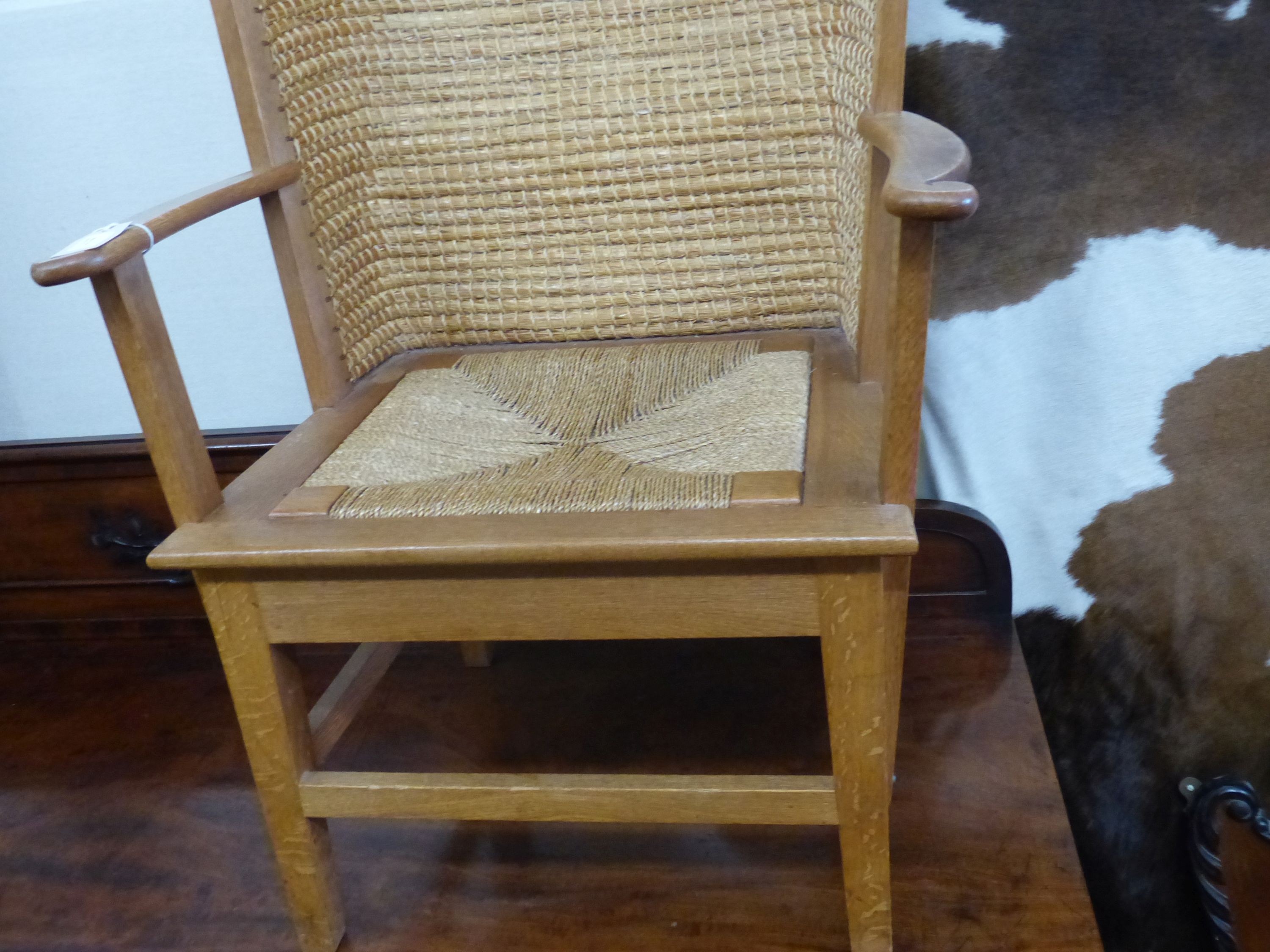 A 20th century light oak and skep work Orkney chair in traditional style, width 63cm, depth 60cm, height 106cm